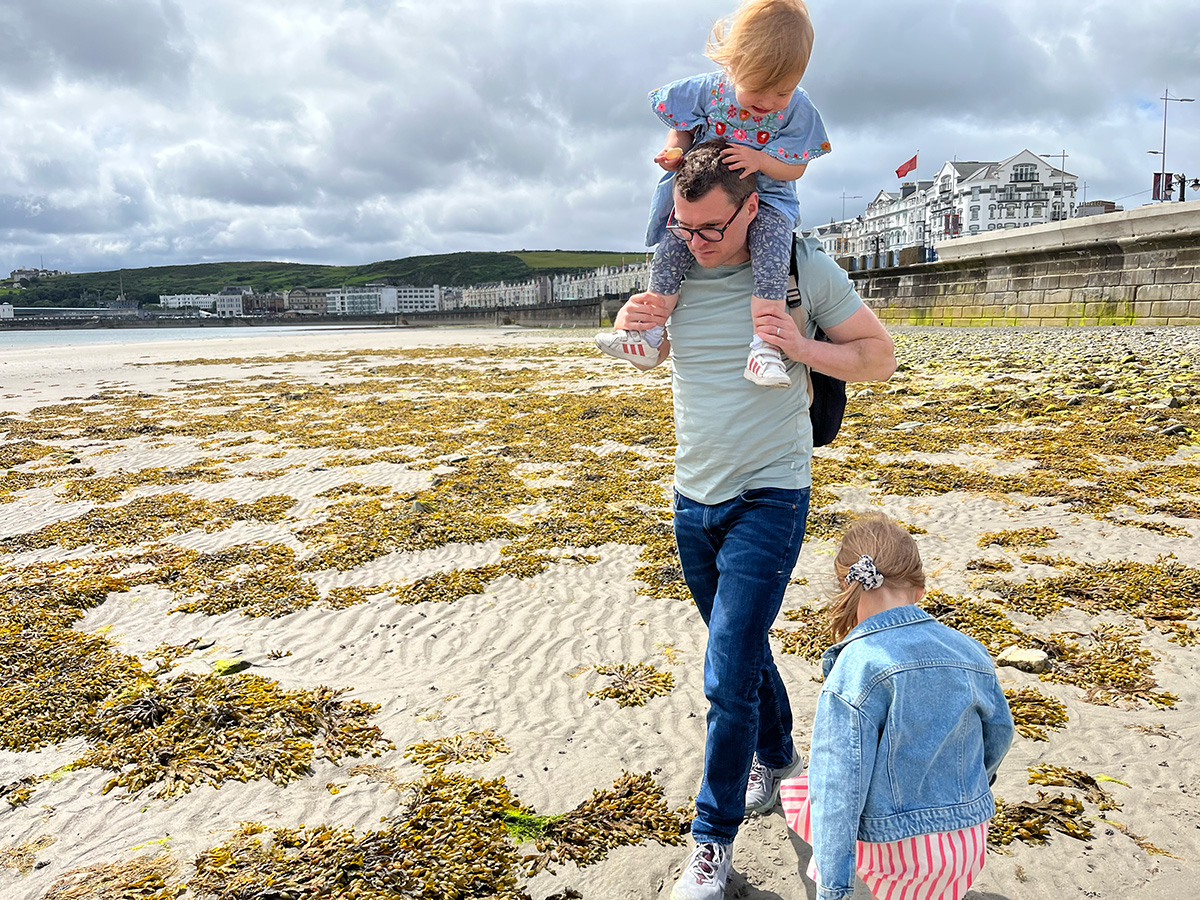 Rob Quirk with his family on the beach